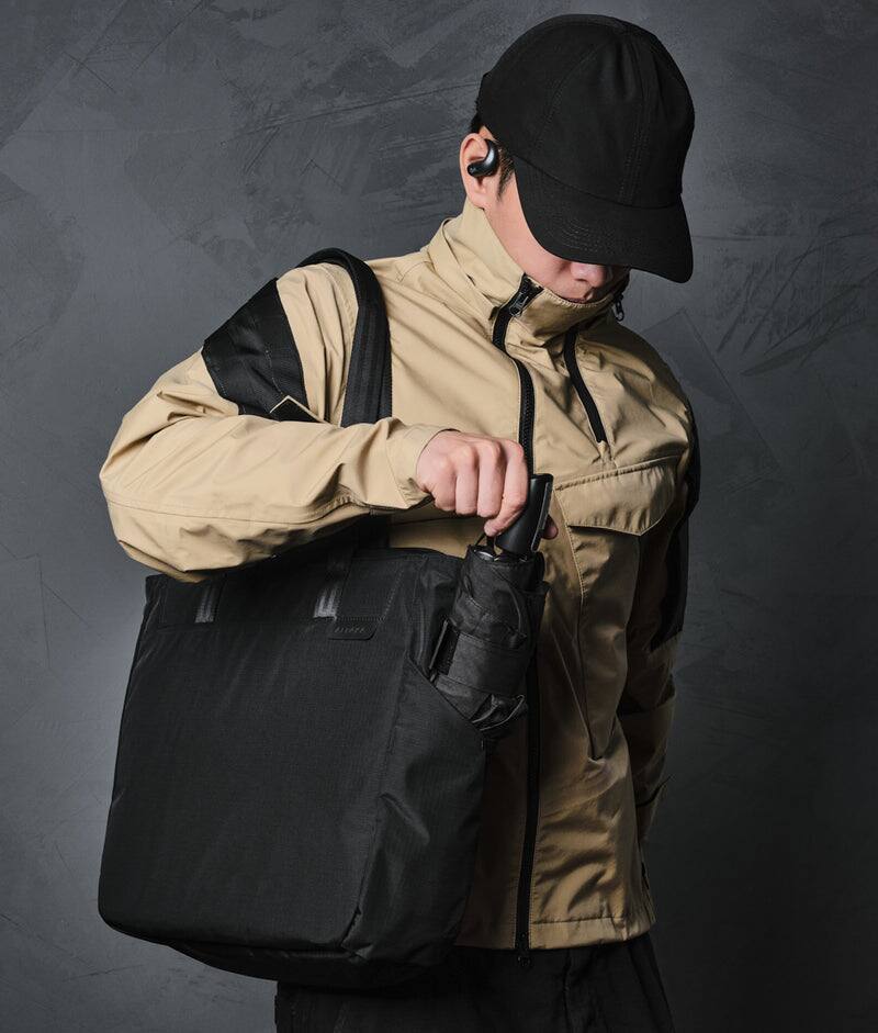 Alt View 1. ALPAKA - Metro Tote Laptop Tote Bag for Work, Work Tote Fits 16" MacBook Pro, Side Bottle Pocket, Weather-Resistant, Key Tether - Black Axoflux 210D.