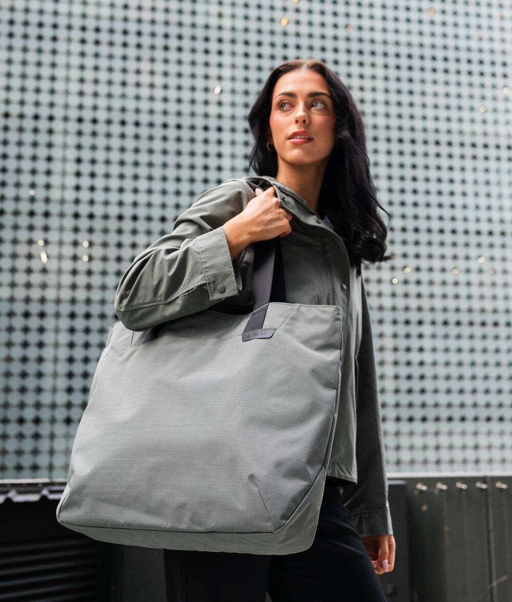 Angle. ALPAKA - Elements Tote 20L Laptop Tote Bag with Padded 16" Sleeve,Open Top with Magnetic Closure - Grey Axoflux 210D.