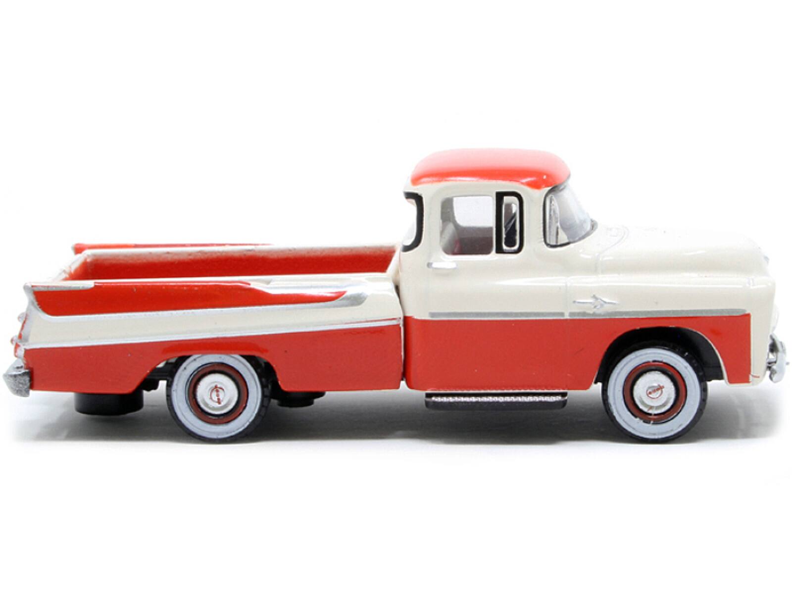 Angle. Oxford Diecast - 1957 Dodge D100 Sweptside Pickup Truck Tropical Coral and Glacier White 1/87 (HO) Scale Diecast Model Car - Coral and Glacier White.