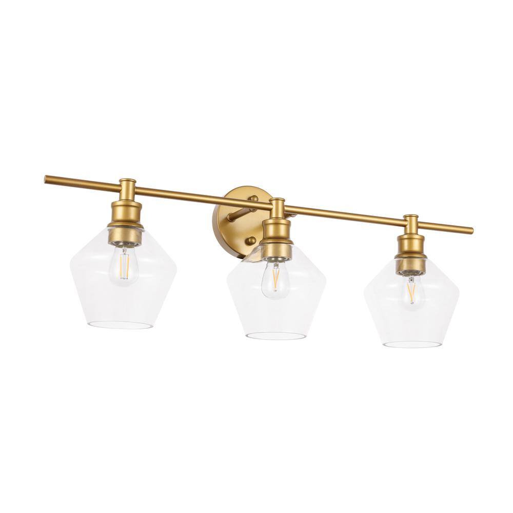 Left. Living District - Gene 3 light Brass and Clear glass Wall sconce - Brass And Clear Glass.