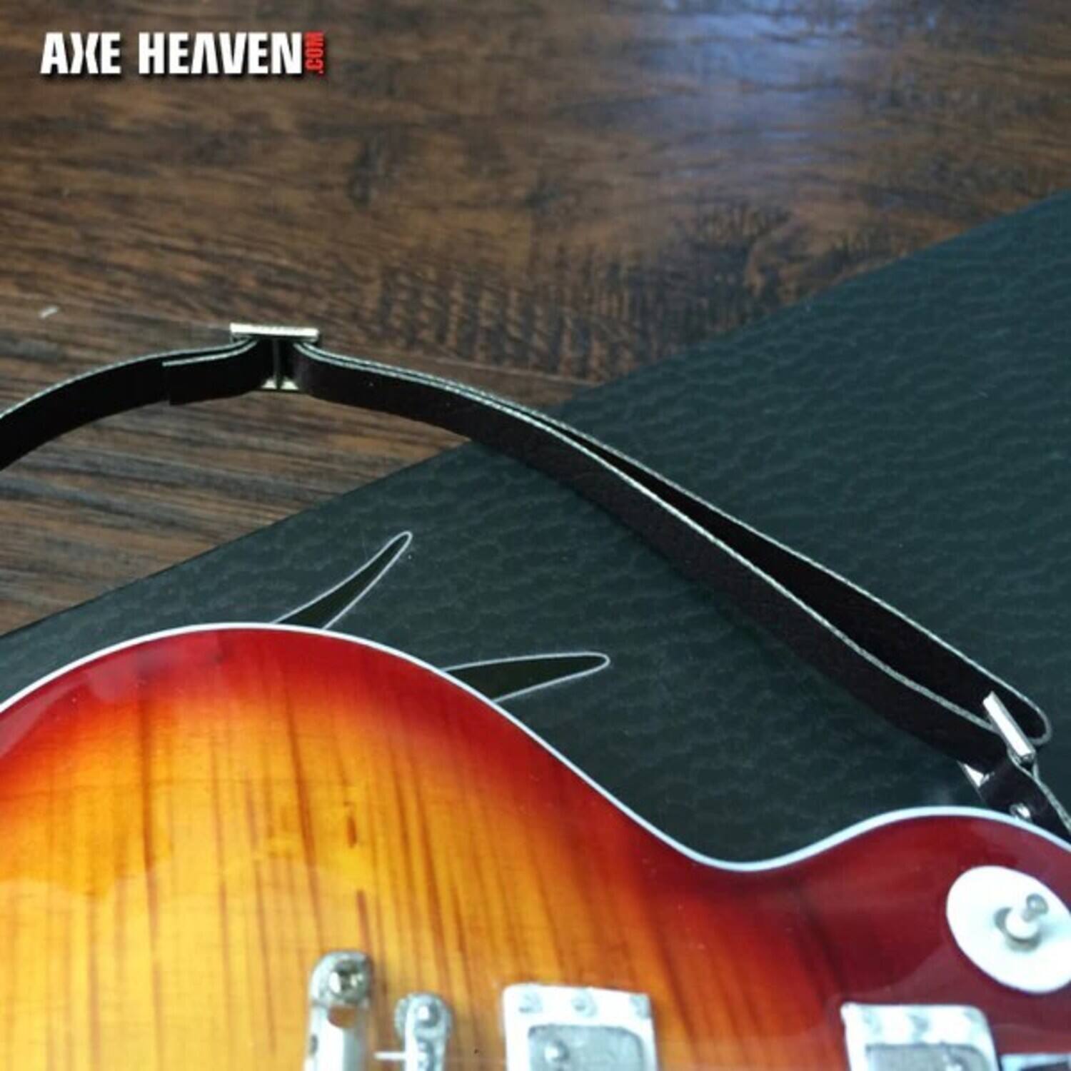 The corrected text is: "AXE HEAVEN .COM"