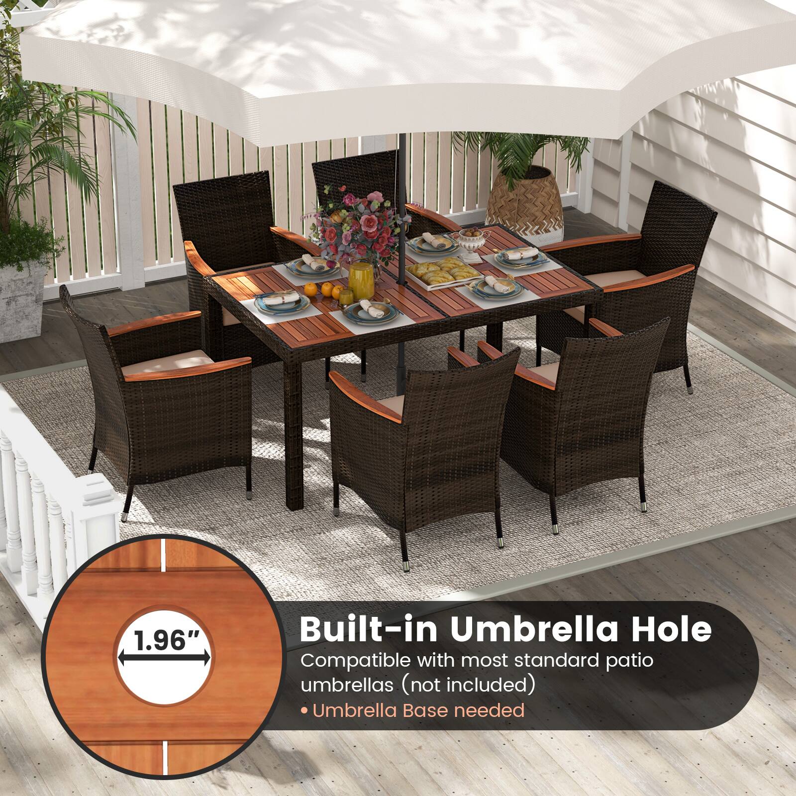 The image features a wooden dining table surrounded by chairs, with a potted plant nearby. The table is set with various items, including bowls, cups, and oranges. The table is also accompanied by a built-in umbrella hole, which is compatible with most standard patio umbrellas. However, the umbrellas are not included in the image, and an umbrella base is needed to use the umbrella hole.