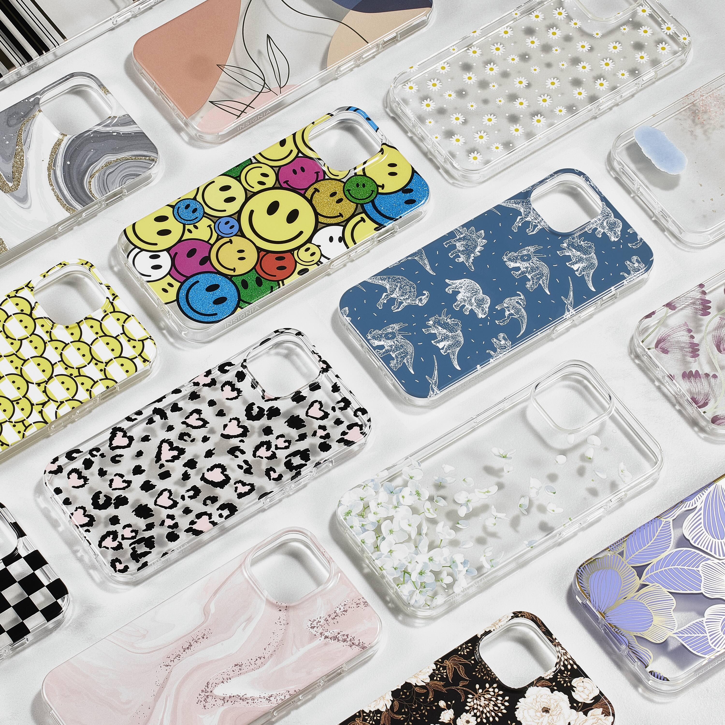 The image shows a variety of cell phone cases displayed on a table. There are nine cases in total, each featuring different designs and colors. The cases are arranged in a row, showcasing their unique styles and patterns. The variety of cases offers a range of options for users to choose from, allowing them to personalize their phone and express their individuality.
