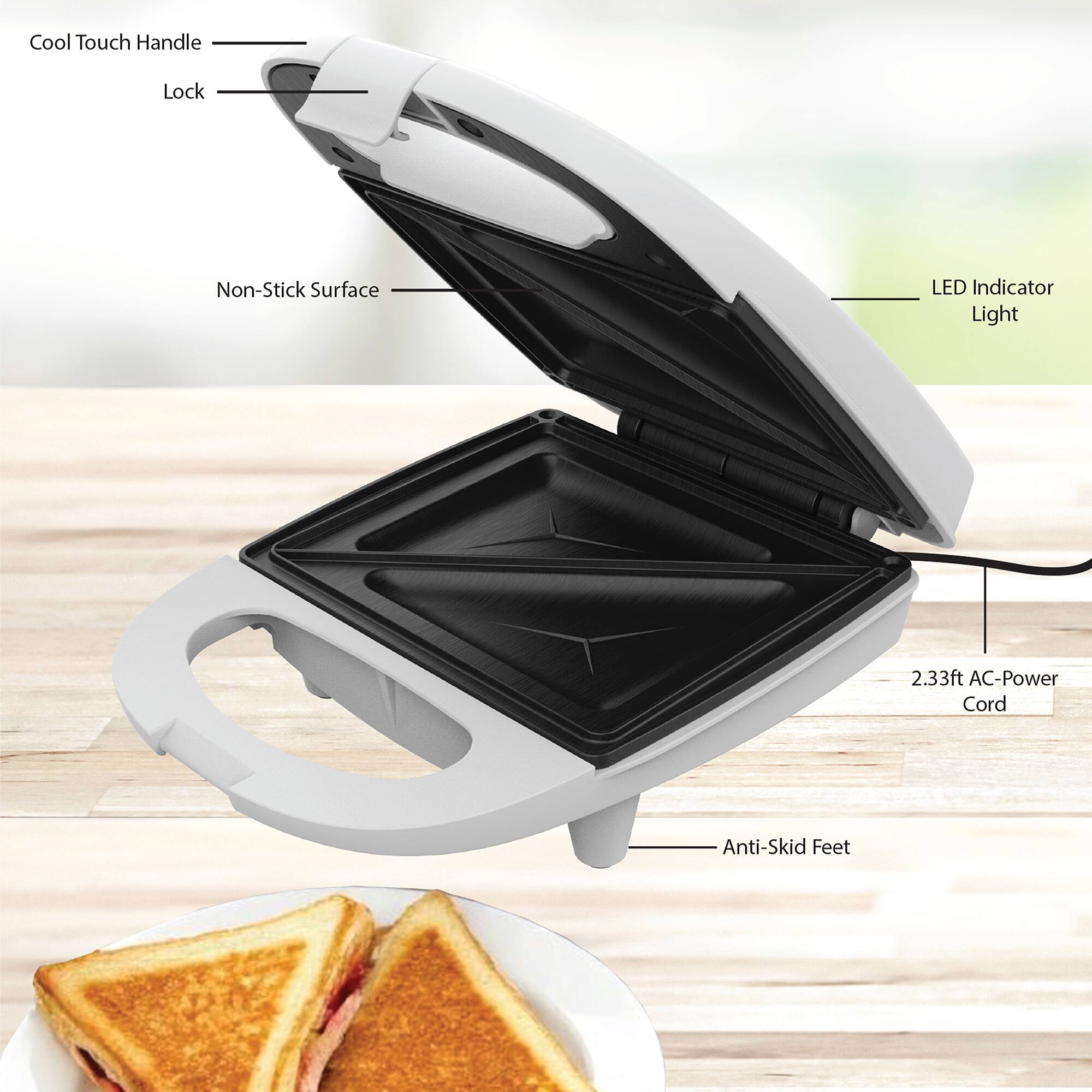 Cool Touch Handle  
Lock  
Non-Stick Surface  
LED Indicator Light  
2.33ft AC-Power Cord  
Anti-Skid Feet