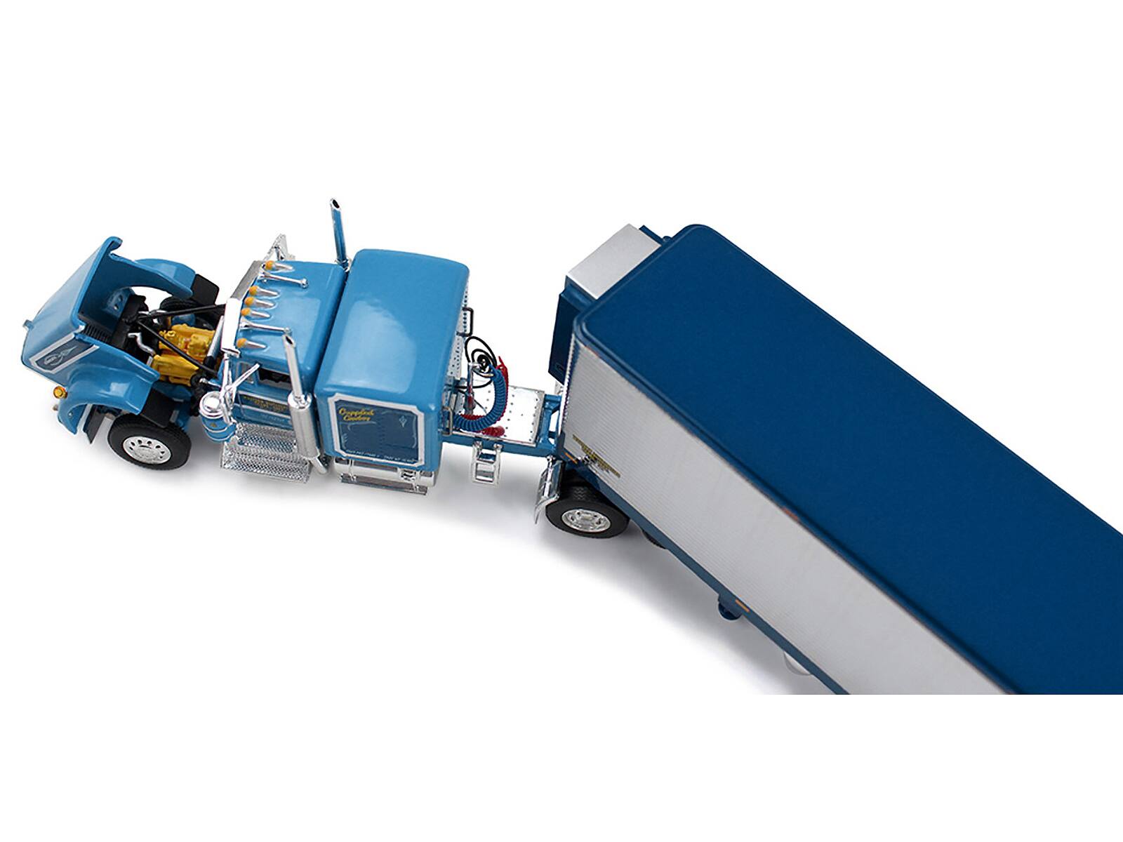 Angle. First Gear - Kenworth W900A with 60 Flat Top Sleeper and 40' Vintage Refrigerated Trailer Crippled Cowboy Blue 1/64 - Blue.