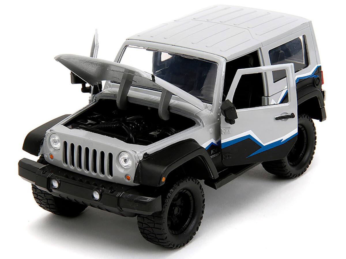 Angle. Jada - 2007 Jeep Wrangler Gray and Black with Blue and White Stripes with Extra Wheels "Just Trucks" Series 1/24 - Gray and Black.