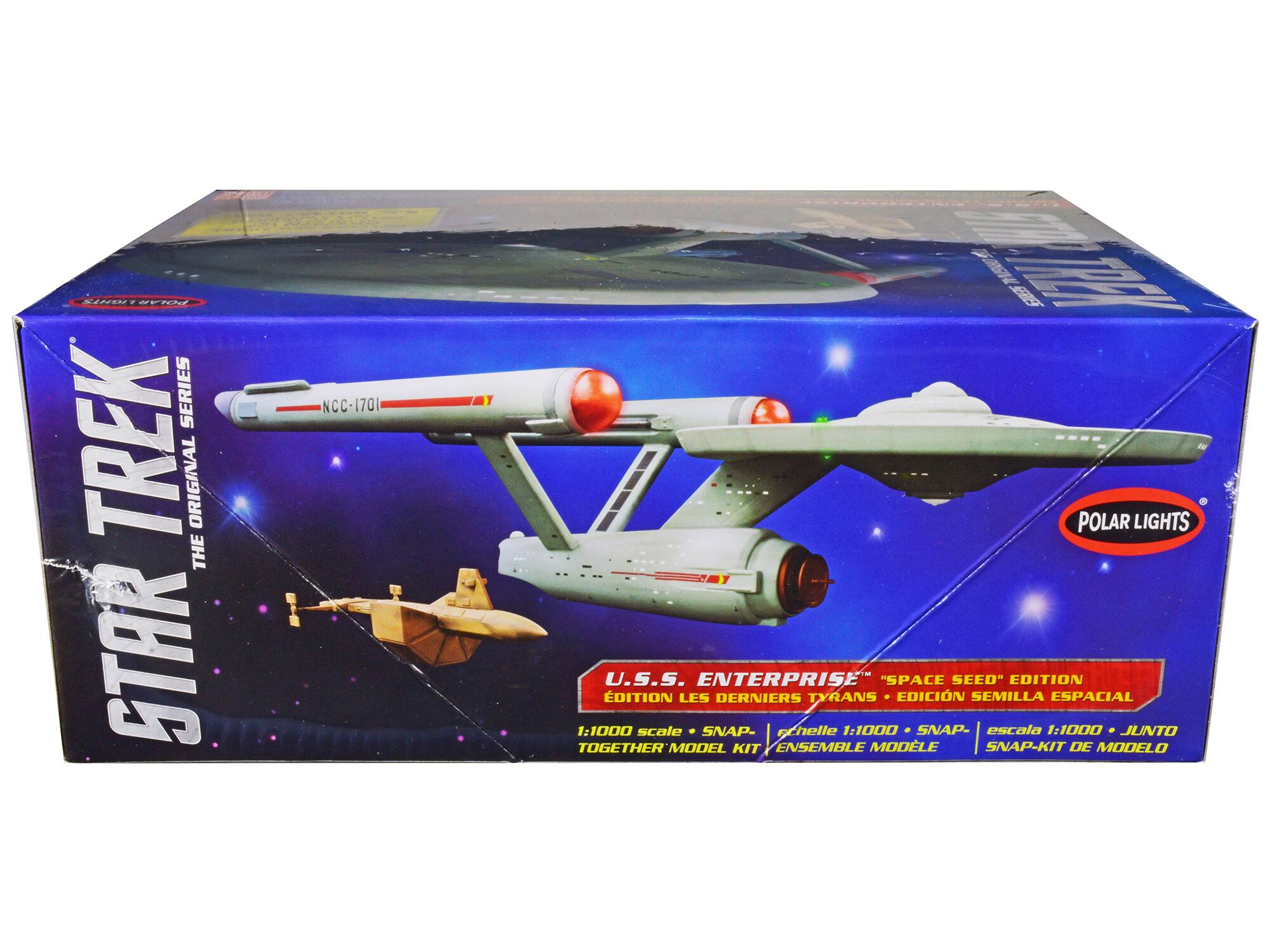 Sure, here is the corrected and grouped text from the image:

---

**STAR TREK**  
THE ORIGINAL SERIES  

**U.S.S. ENTERPRISE**  
"SPACE SEED" EDITION  
ÉDITION LES DERNIERS TYRANS  
EDICIÓN SEMILLA ESPACIAL  

1:1000 scale • SNAP-TOGETHER MODEL KIT  
Échelle 1:1000 • ENSEMBLE SNAP-KIT DE MODELO  
escala 1:1000 • SNAP-KIT DE MODELO  

**POLAR LIGHTS**  

---

This text is organized to reflect the information on the box, including the series, edition, scale, and model kit details.