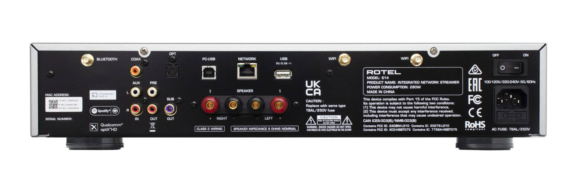 The text on the image is grouped and corrected as follows:

1. MAC ACORESS SERIAL NUMBER BLUETOOTH COAX AUX Creamecan L bata Spotify* R IN Qualcomm X aptX"HD PRE OUT OPT SUB OUT PC-USB NETWORK USB WIFI SV/2.DA - UK SPEAKER CAUTION Replace with same type TBAL voes fuse RIGHT LEFT CAUTION - - -- -  I WANNG SHOCK NAZARD D0 NCT OPEN CLASS 2 WIRING SPEAKER MPEDANCEI . CHMS NOMINAL -- - CHIC CTA - - OFF ON WFI O ROTEL MODEL: S14 PRODUCT NAME: INTEGRATED NETWORK STREAMER 100-120V/220240V-50/80H POWER CONSUMPTION 280W EAC MADE IN CHINA

This device complies with Part 15 of the FCC Rules. FC Ro operation is subject to the following CWO conditions: 1] This device may not cause harmful interference. ] This device must accept any interference received, including interference that may cause undesired operation. CAN ICES-003(BI/NMB-003(B) Contains FCC D SACIIM-LSTO Contains C 20278LS10 RoHS Centains FCC D XCD-HST07S Contains IC 77564HS87075 complient AC FUSE: TBAL/250V