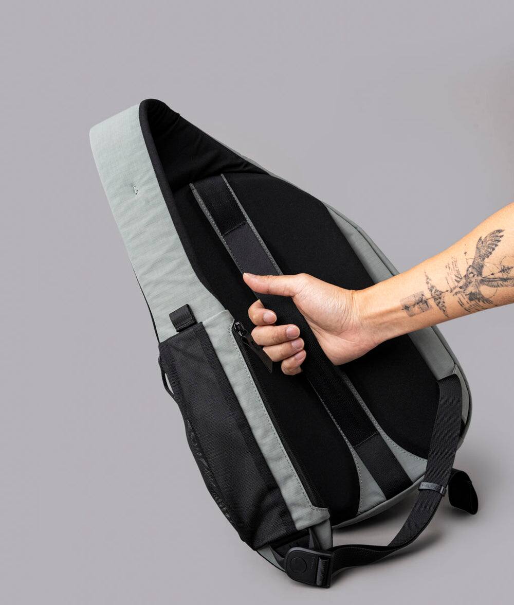 Back. ALPAKA - Crossbody Sling Bag 7.5L (Right Shoulder) for Men, Fits 11" Tablet, Phone Sleeve, Bottle Pocket, Luggage Pass-Through - Grey Axoflux 210D.