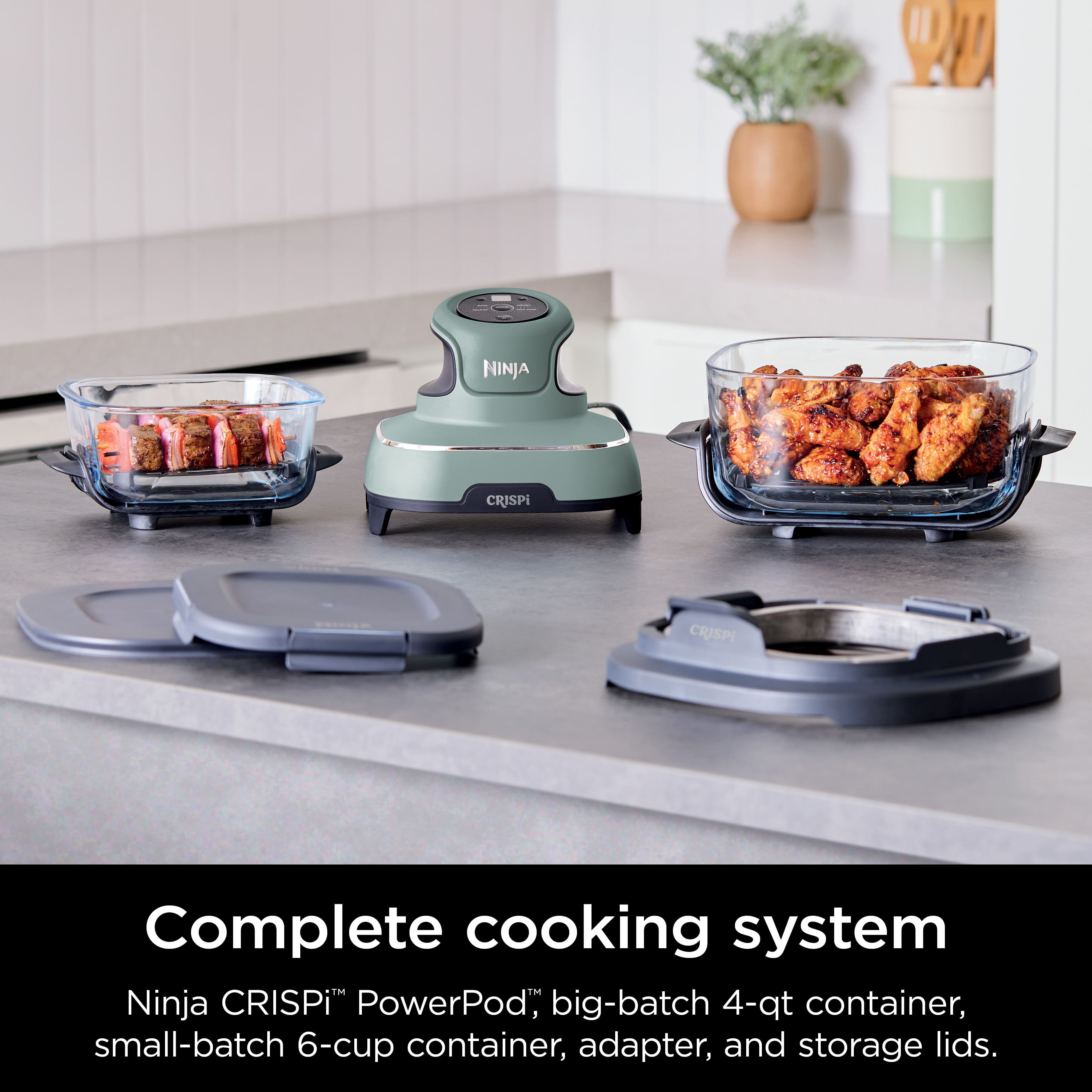 The image features a complete cooking system from Ninja, which includes a PowerPod, a big-batch 4-qt container, a small-batch 6-cup container, an adapter, and storage lids.