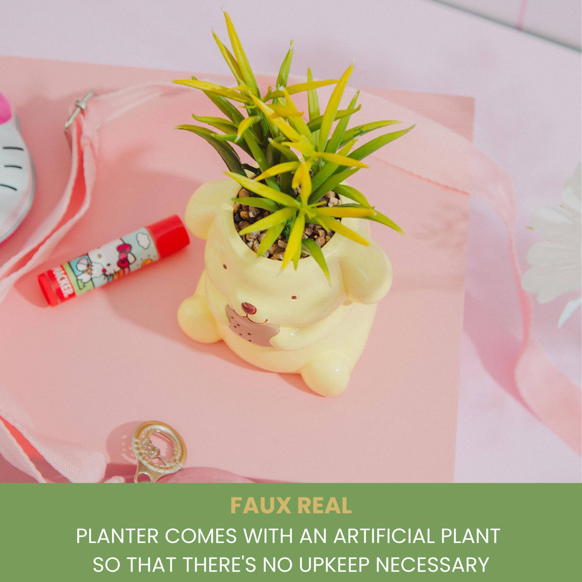 FAUX REAL  
PLANTER COMES WITH AN ARTIFICIAL PLANT SO THAT THERE'S NO UPKEEP NECESSARY