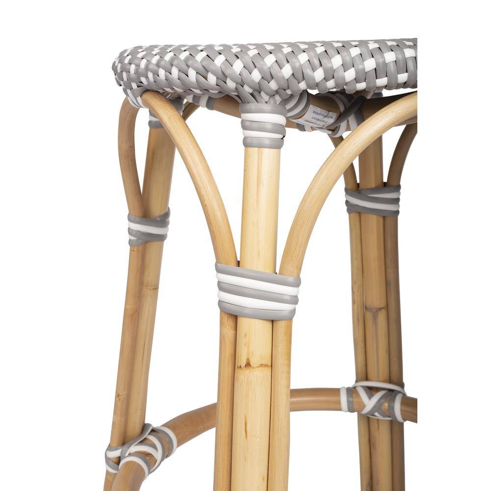 Left. Butler Specialty - Tobias Rattan Round 24" Counter Stool - Gray And White Dot.