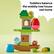 Toddlers balance the wobbly tree house owl home.