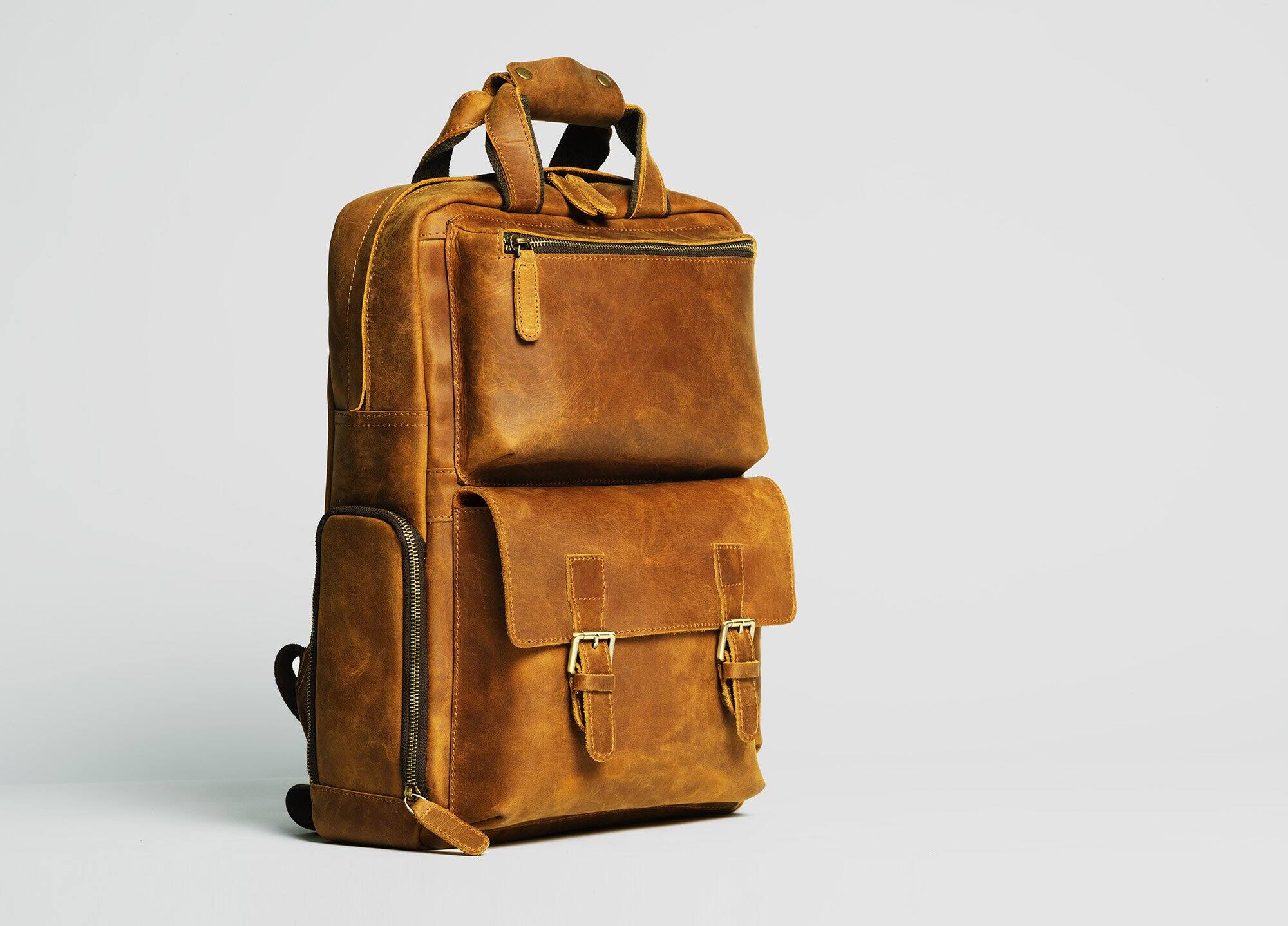 Angle. Steel Horse Leather - The MANN Bag | Large Capacity Leather Camera Backpack - Brown.