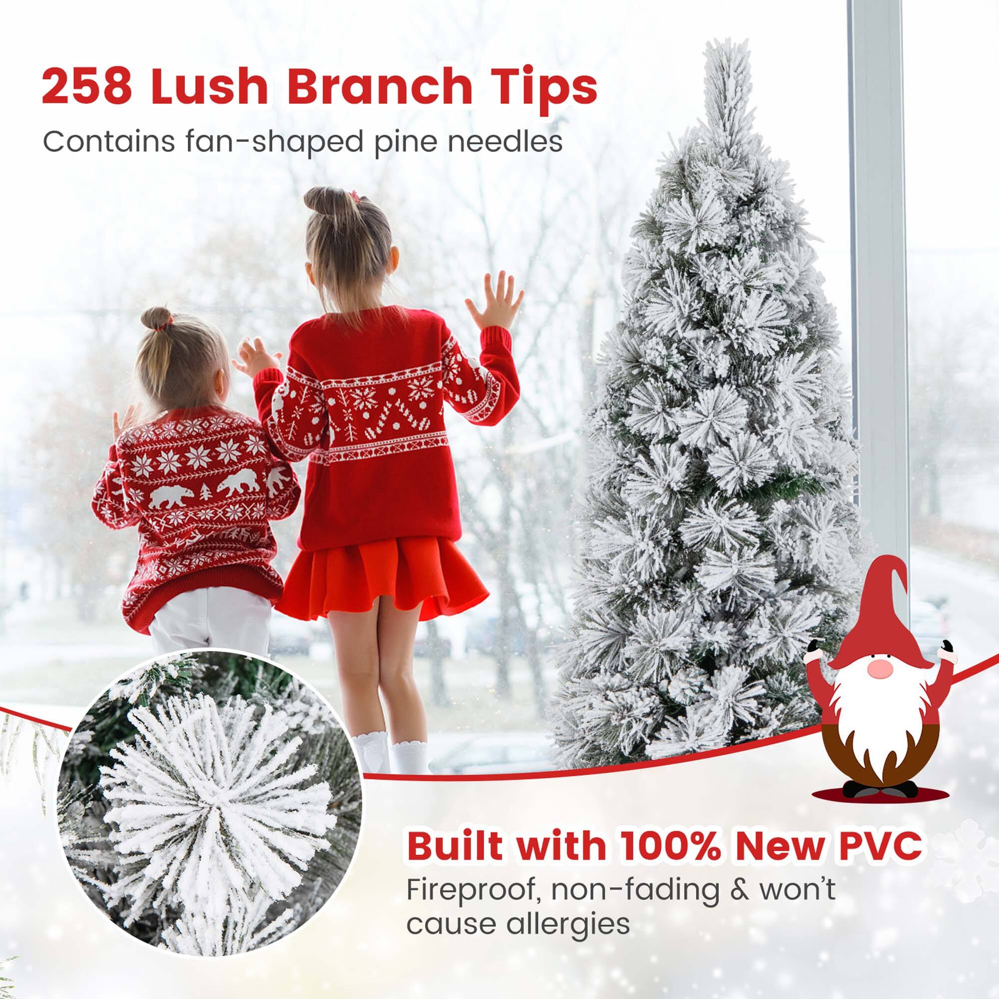 The image features two little girls standing in front of a Christmas tree. The text on the image reads, "258 Lush Branch Tips Contains fan-shaped pine needles Built with 100% New PVC Fireproof, non-fading & won't cause allergies." This suggests that the Christmas tree is made with a special type of branch that contains fan-shaped pine needles and is built with 100% new PVC, making it fireproof, non-fading, and allergy-free.
