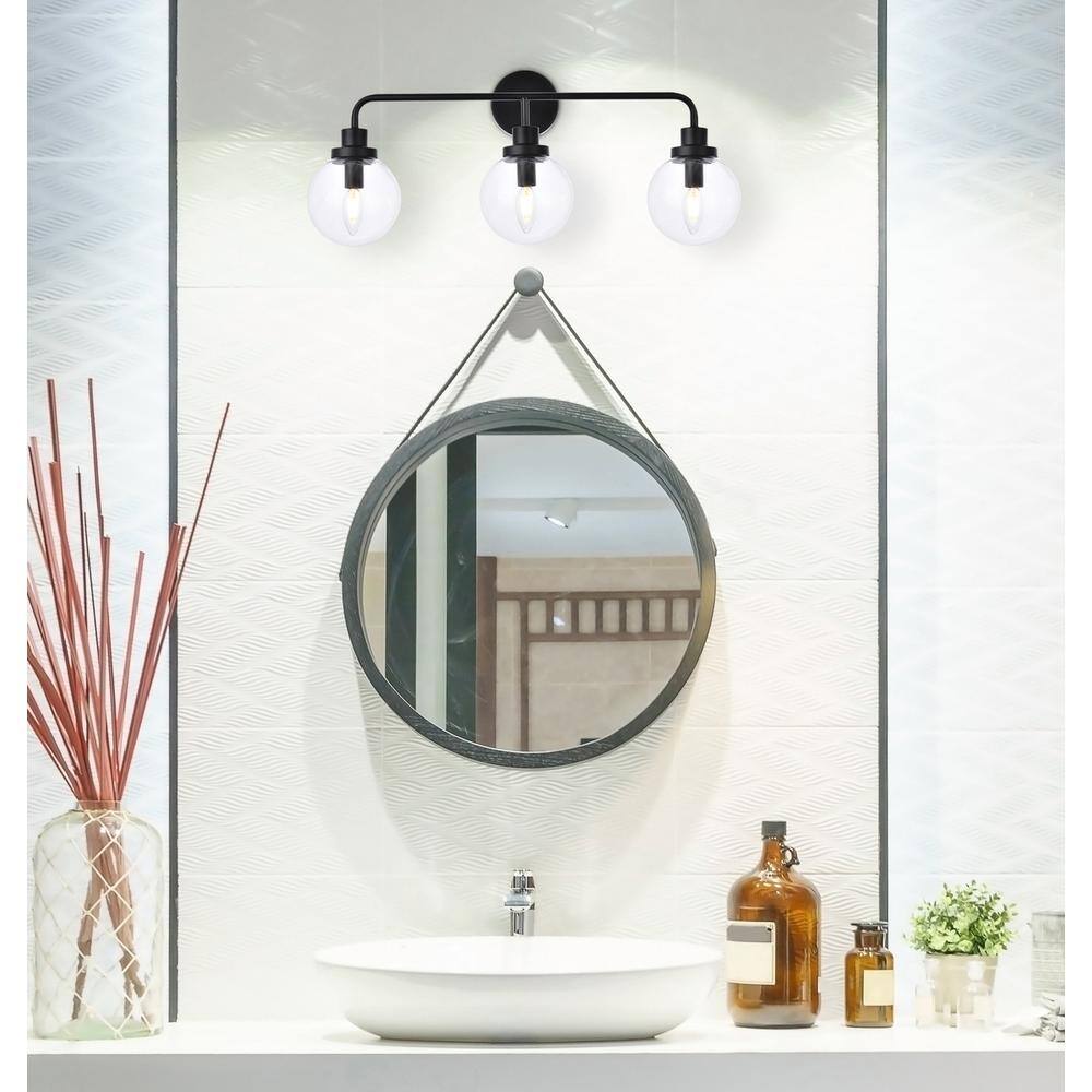 Angle. Living District - Hanson 3 lights bath sconce in black with clear shade - Black And Clear Shade.