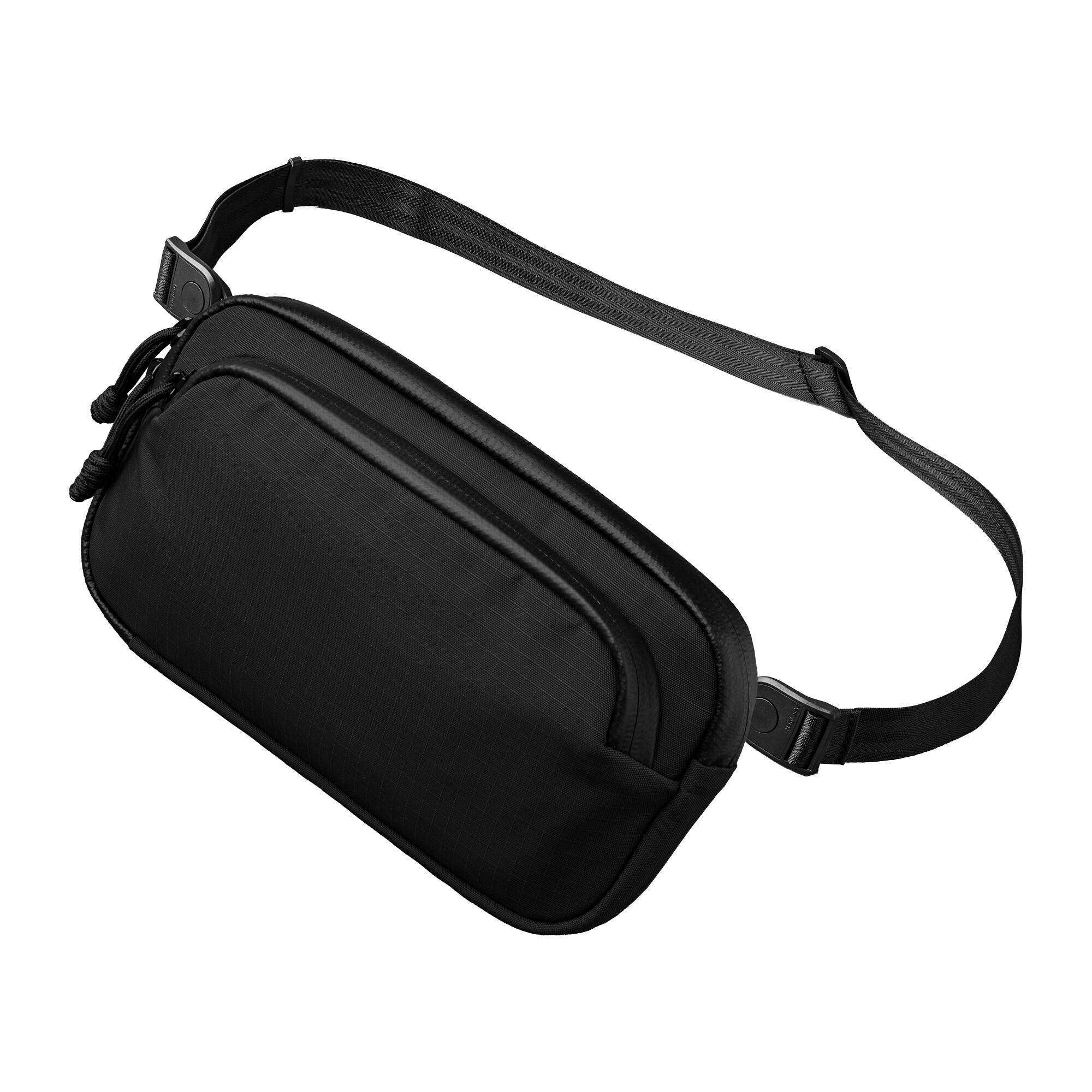 Front. ALPAKA - Bravo Passport Pouch Sling Bag for Men, Passport Holder for Travel, Fits iPhone Pro Max, RFID, AirTag Sleeve - Black Axoflux 210D.