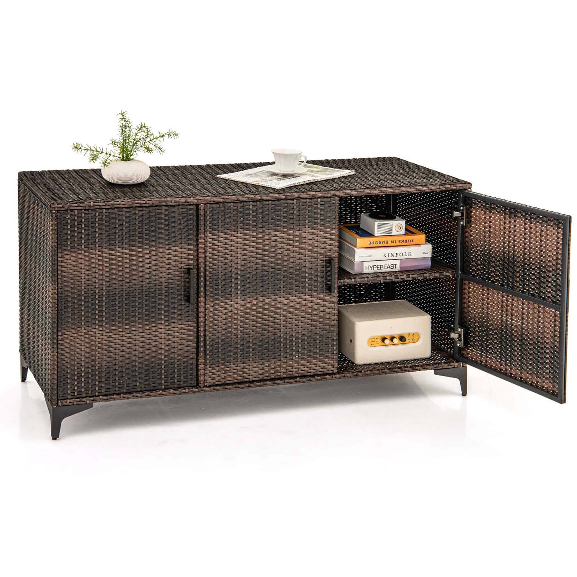 The image features a brown wicker dresser with a drawer and a shelf. On the shelf, there are several books neatly arranged. The drawer is filled with various items, including a cup, a potted plant, and a remote control. The books are of different sizes and are placed in a way that they are easily accessible. The dresser appears to be a functional and stylish piece of furniture, providing storage and display space for the items.