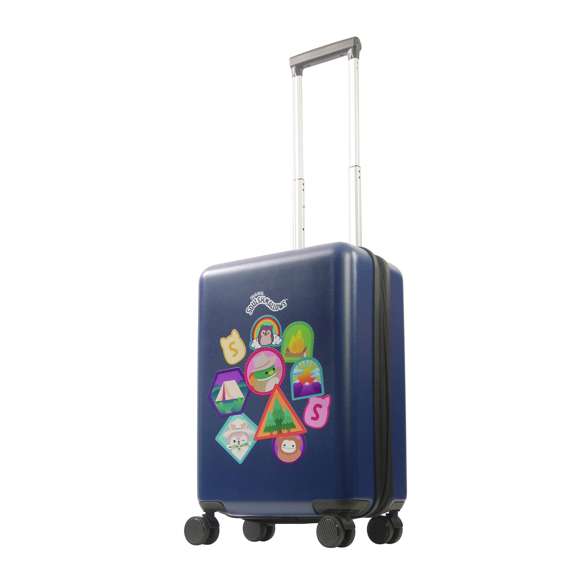 A suitcase with a design featuring camping and nature elements, including a tent, a campfire, a sun, a tree, and a rabbit. The text on the suitcase reads "SQUISHMALLOWS."