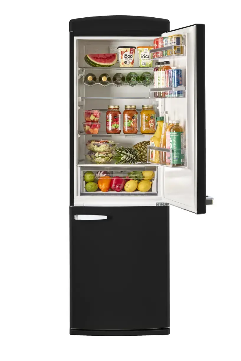 The text on the image reads: "MLN - ioGO | I - I - ade iG cimmu'e by bly di - a AO - B J RIOL MIOC E c -   Ld". This text is likely a combination of various food items and brands found in the refrigerator. The refrigerator is filled with a variety of food items, including fruits, vegetables, and drinks.