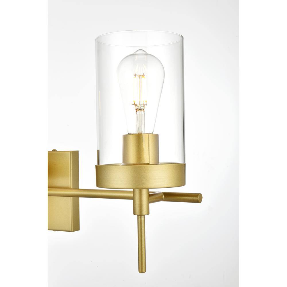 Left. Living District - Benny 3 light Brass and Clear Bath Sconce - Brass And Clear.