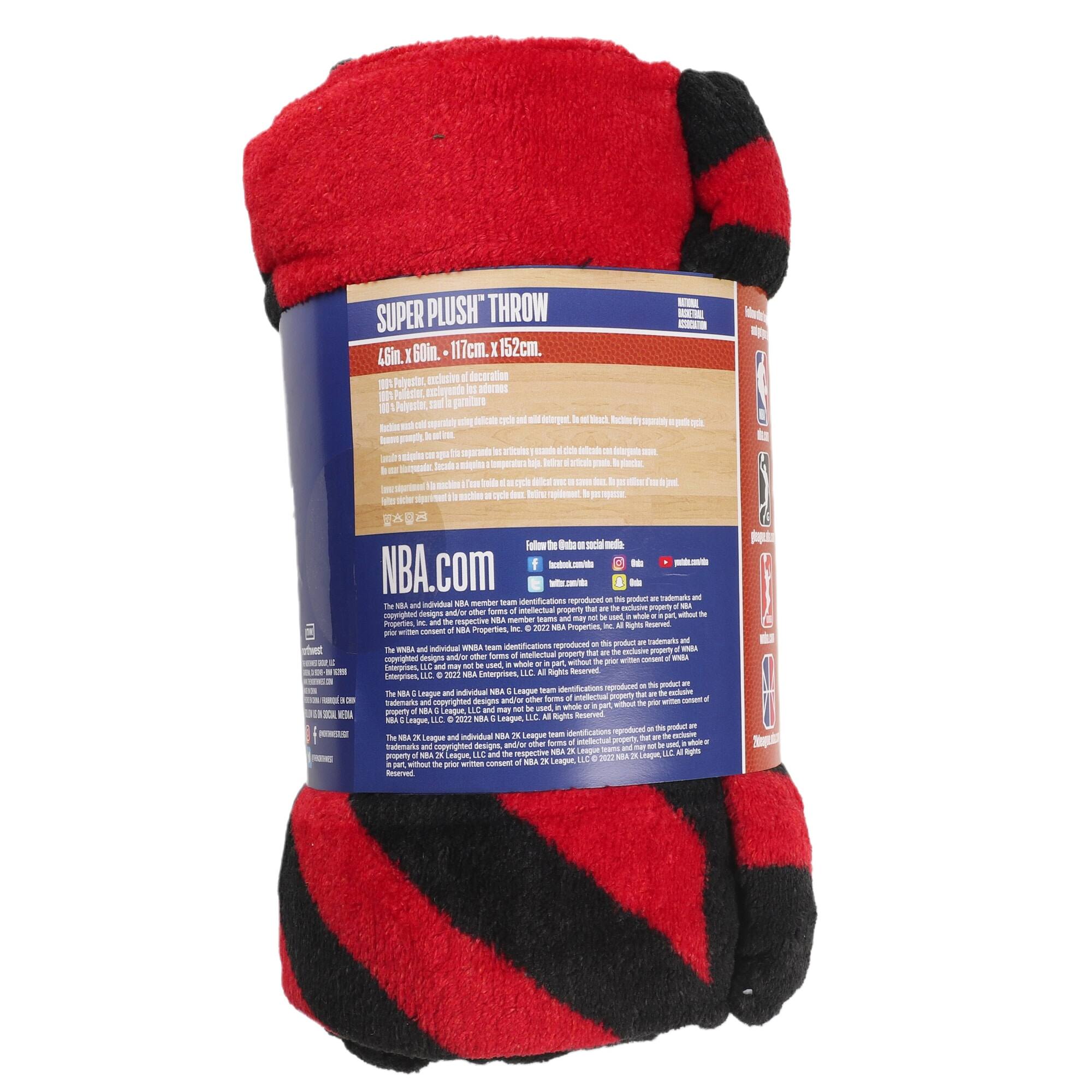 **SUPER PLUSH THROW**  
46in. x 60in. - 117cm. x 152cm.  

100% Polyester, exclusive of any metal.  
100% Polyester, exclusive of any metal.  

**NBA.com**  
The NBA and individual NBA member team identifications and logos, and all associated imagery and indicia are trademarks and/or copyrights of NBA Properties, Inc. © 2022 NBA Properties, Inc. All Rights Reserved.  
The NBA League and individual NBA League identifications and logos, and all associated imagery and indicia are trademarks and/or copyrights of NBA Properties, Inc. © 2022 NBA Properties, Inc. All Rights Reserved.  
The NBA 75 League and individual NBA 75 League identifications and logos, and all associated imagery and indicia are trademarks and/or copyrights of NBA Properties, Inc. © 2022 NBA Properties, Inc. All Rights Reserved.  

**NBA.com**  
The NBA and individual NBA member team identifications and logos, and all associated imagery and indicia are trademarks and/or copyrights of NBA Properties, Inc. © 2022 NBA Properties, Inc. All Rights Reserved