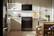 Alt View 2. Whirlpool - 30 in. Wide 4 burners 5.0 cu. ft. Smart Freestanding Slide-In Gas Range with Air Cooking Technology and Steam Clean - Black-on-Stainless.