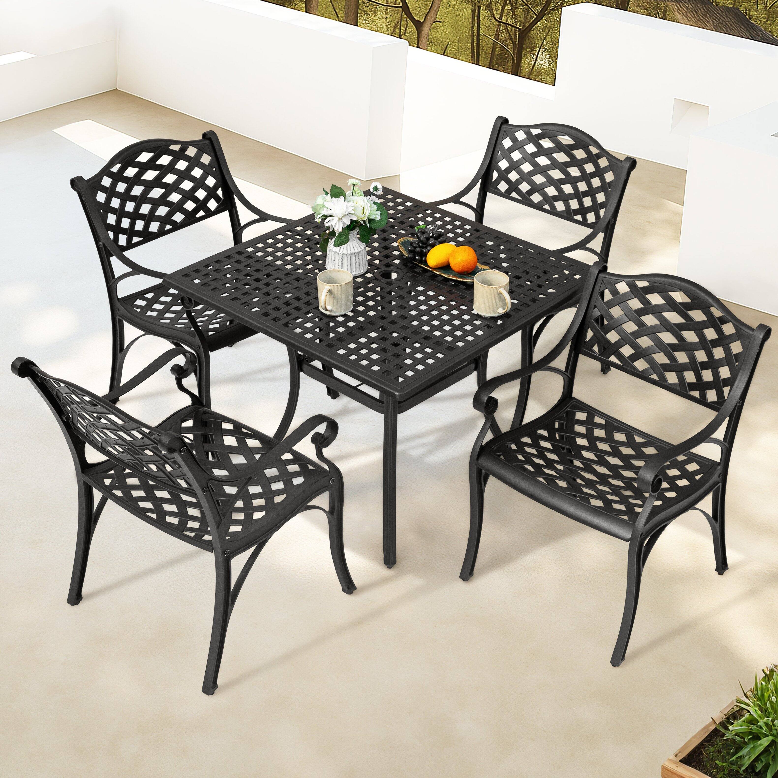 Left. Nuu Garden - 5-Piece Cast Aluminum Patio Dining Set with Umbrella Hole and Wide Seat - Black with Gold Speckles.