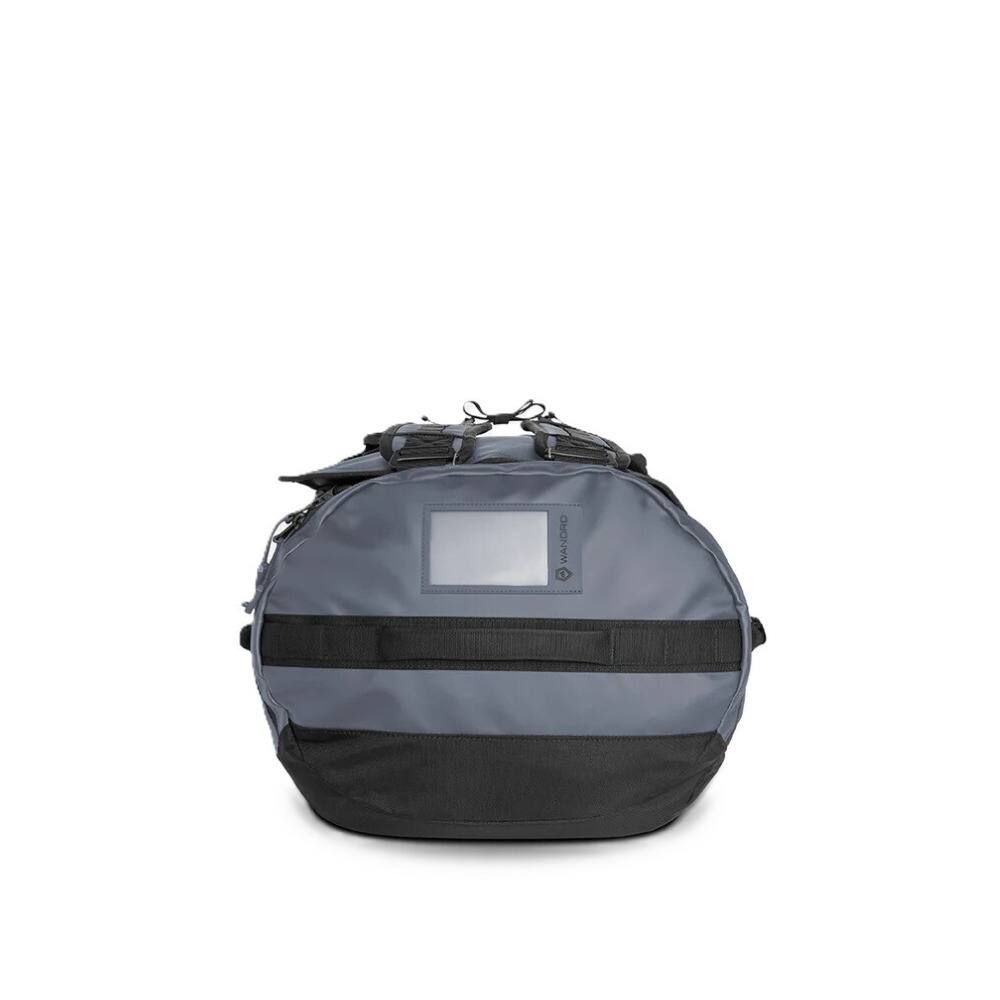 Left. WANDRD - WANDRD CARRYALL 60L Duffel Bag - Rugged Travel and Gear Hauler (Aegean Blue) - Blue.