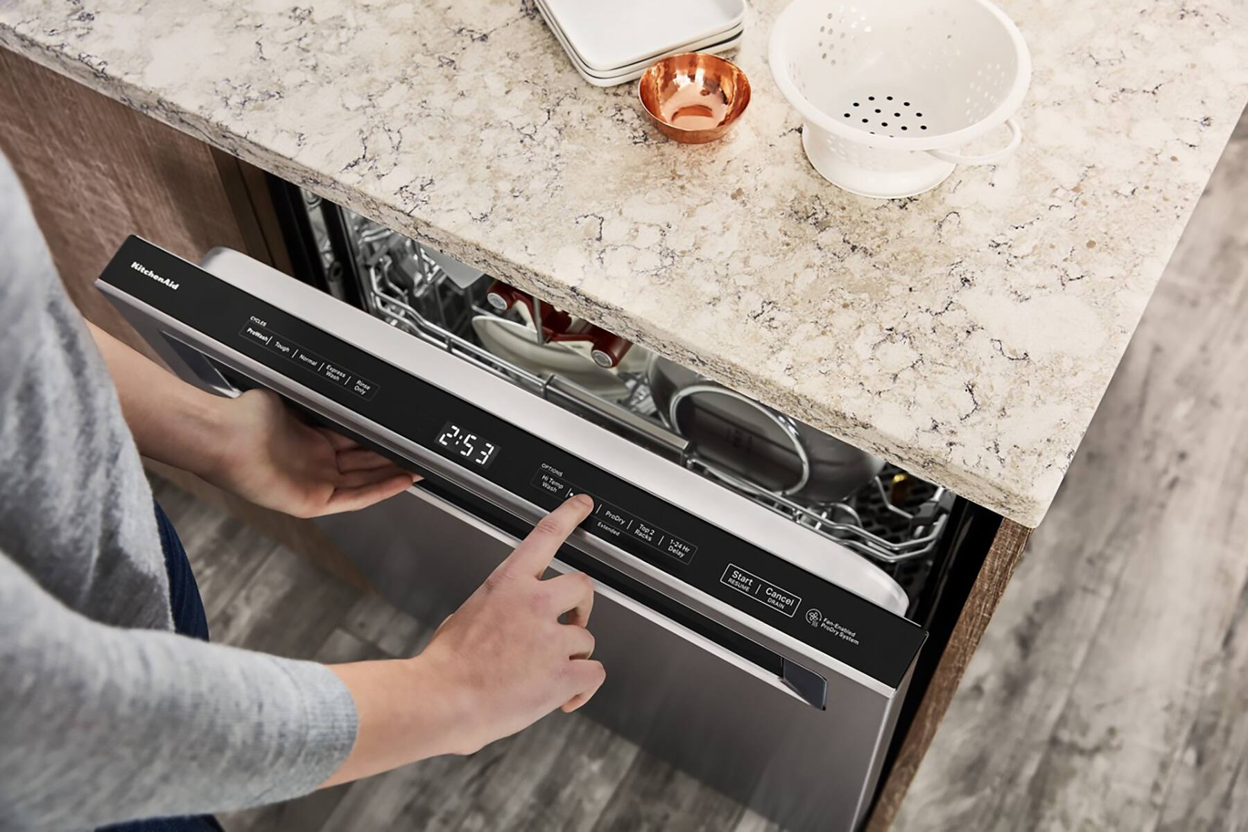 The text on the image reads: "MitchenAid n nt Smoph I Nrmal I -esh Enpress I Rned Dnly 2:5 3 OTINE - Wa ProDry dniened Racks Toe2 I 1-243 Deay RESUNE Start I Cancel GRAIN Prodry."