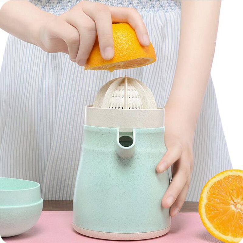 Left. Forest'nSky - Manual Citrus Juicer - 2-in-1 Lemon Orange Press with Strainer & Pour Spout Container in Green - Green.