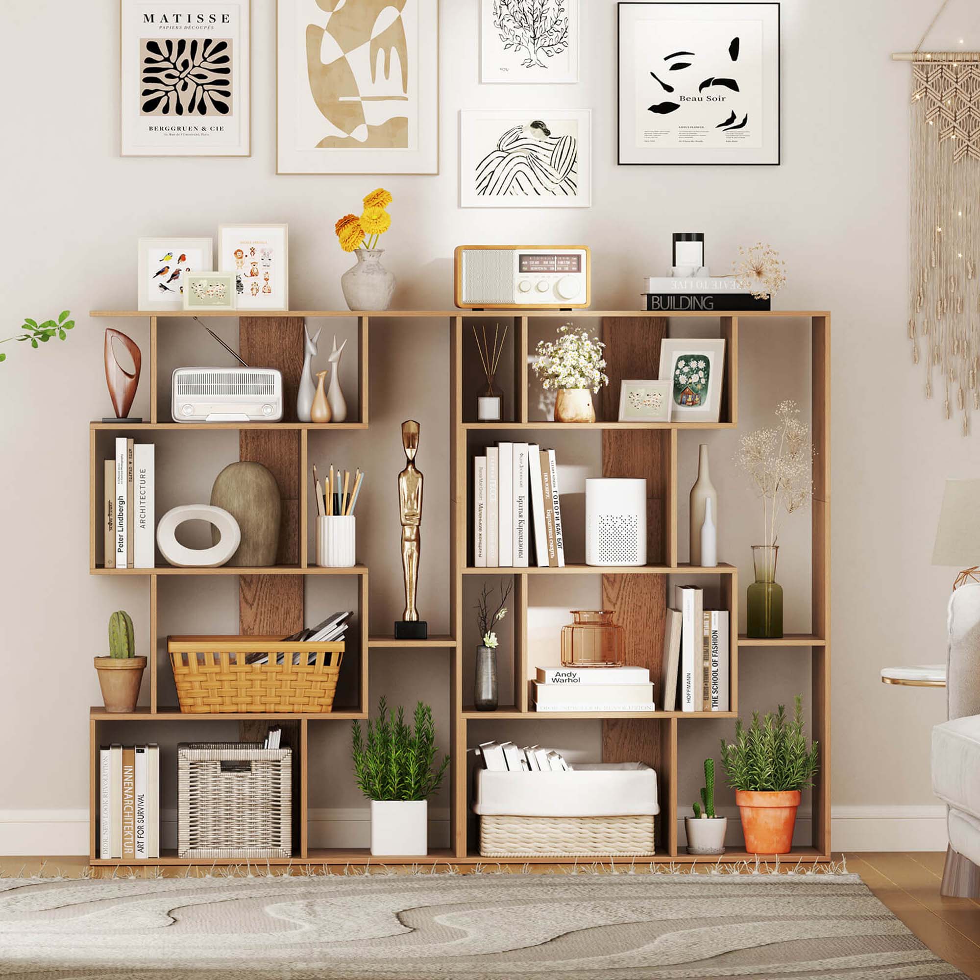 The image features a bookshelf filled with various items, including books, vases, and potted plants. There are at least 13 books on the shelf, with some placed on the top, middle, and bottom sections. The bookshelf is situated in a living room, and there is a rug nearby. The room also contains a couch and a chair, providing a cozy and comfortable atmosphere for reading and relaxing.