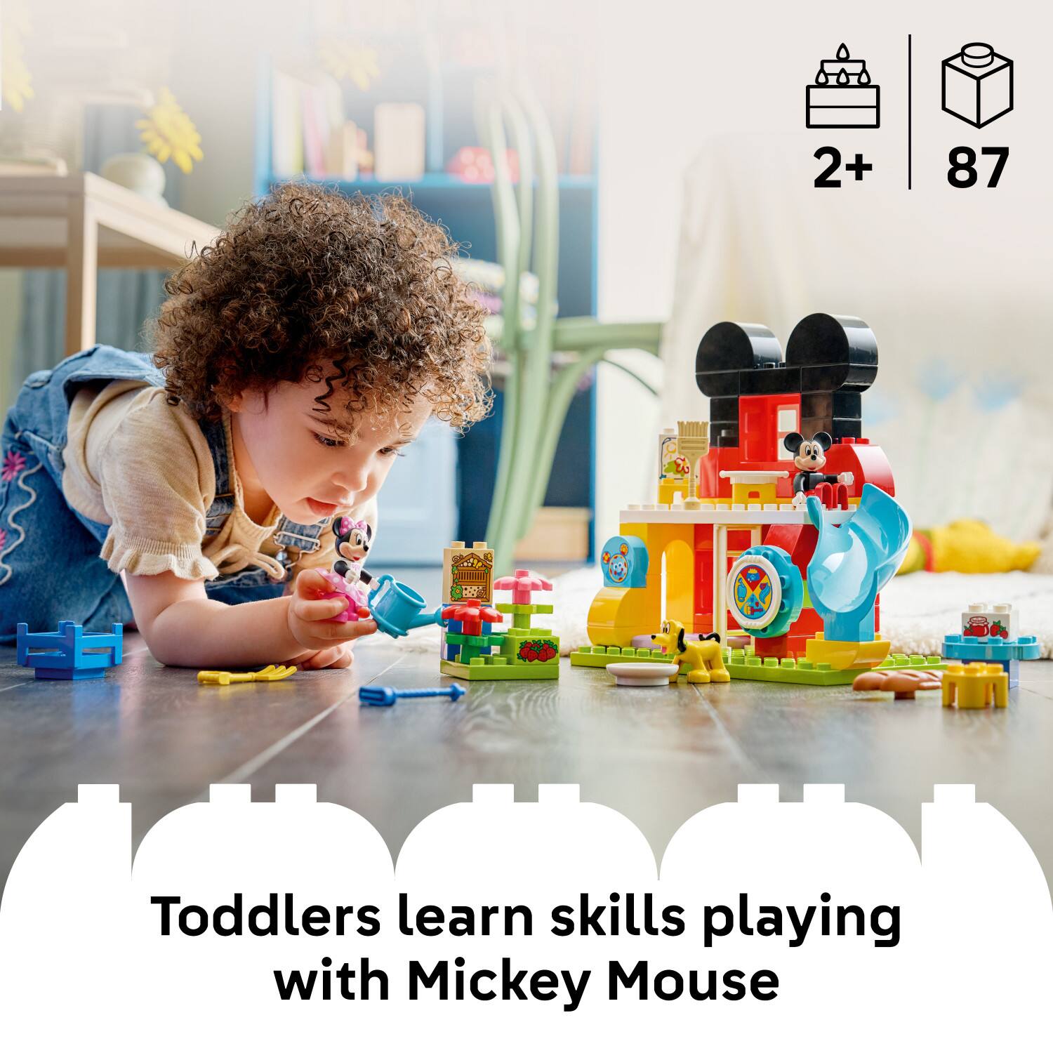 2+ 87  
uHn DO  
da  
Toddlers learn skills playing with Mickey Mouse