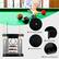 The image features a pool table with a variety of pool balls and cues. There are four anti-falling design round edges, and the table has a painted surface. Additionally, there is a pool cue fixing hole, and the table is equipped with round edges to prevent the balls from rolling off.