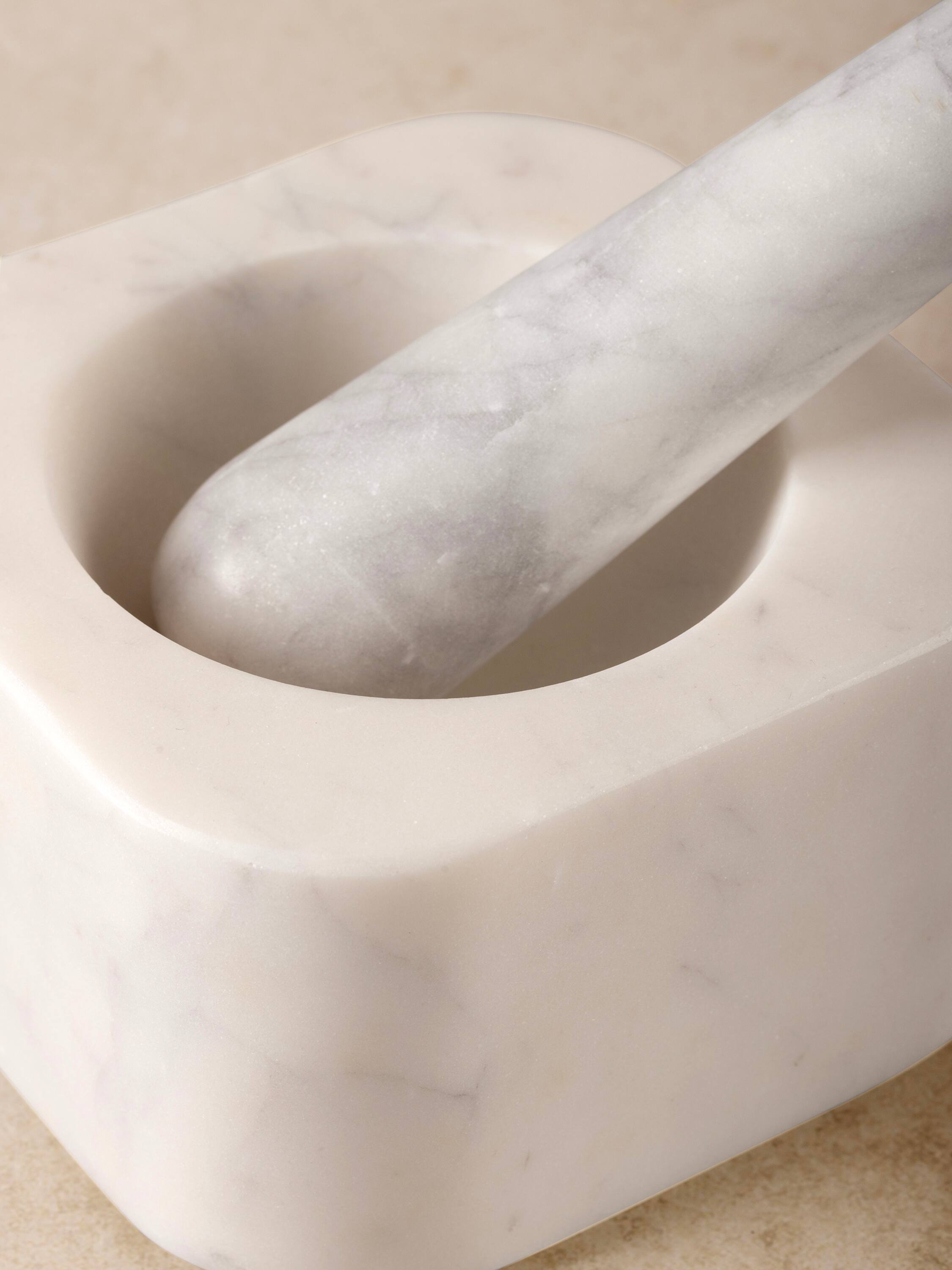 Left. GAURI KOHLI - Noble Mortar and Pestle - Shades of white.