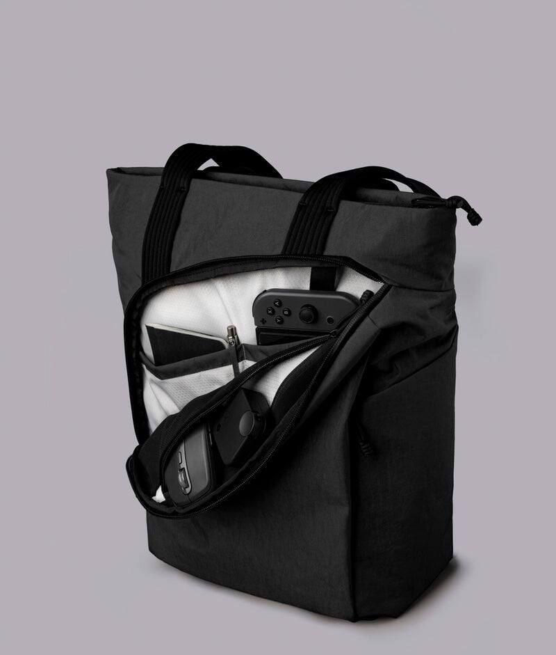 Alt View 3. ALPAKA - Flow Totepack Laptop Backpack for Men, 16" Laptop Compartment + 11" Tablet Sleeve, Tote/Backpack, Bottle Pocket - Black Axoflux 400D Washed Nylon.