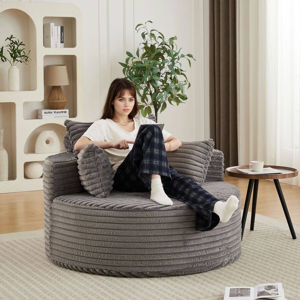 A beautiful woman sitting on a couch.