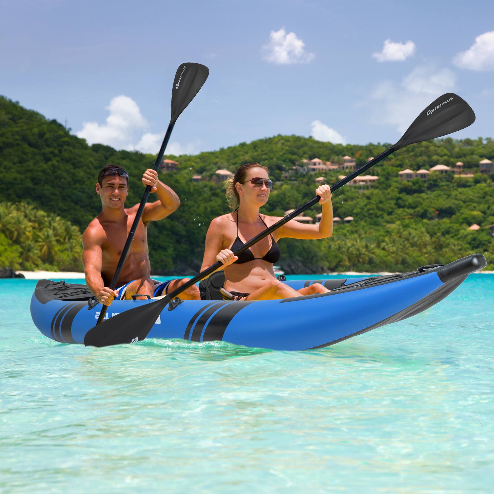 The image shows a man and a woman paddling a blue kayak in the ocean. The man is on the left side of the kayak, while the woman is on the right. They are both holding paddles and enjoying their time on the water. The scene is set against a backdrop of a beautiful beach, with palm trees visible in the distance. The couple appears to be having a great time as they navigate the ocean together.