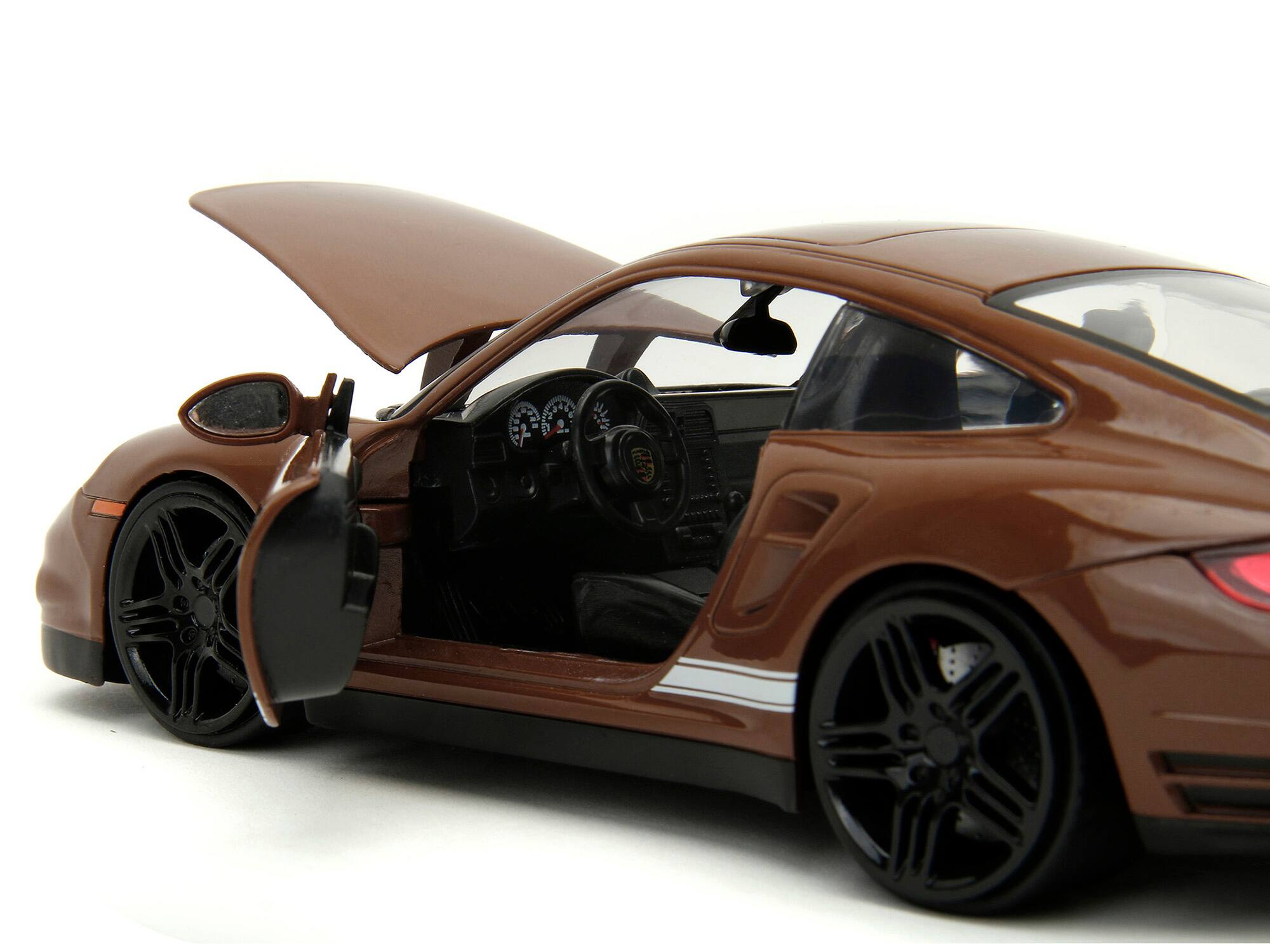 Left. Jada - Porsche 911 Turbo Brown and Brown M&M Diecast Figure "M&M's" "Hollywood Rides" Series 1/24 Diecast Model Car by Jada - Brown.