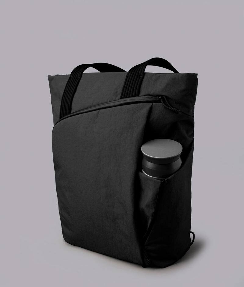 Alt View 6. ALPAKA - Flow Totepack Laptop Backpack for Men, 16" Laptop Compartment + 11" Tablet Sleeve, Tote/Backpack, Bottle Pocket - Black Axoflux 400D Washed Nylon.