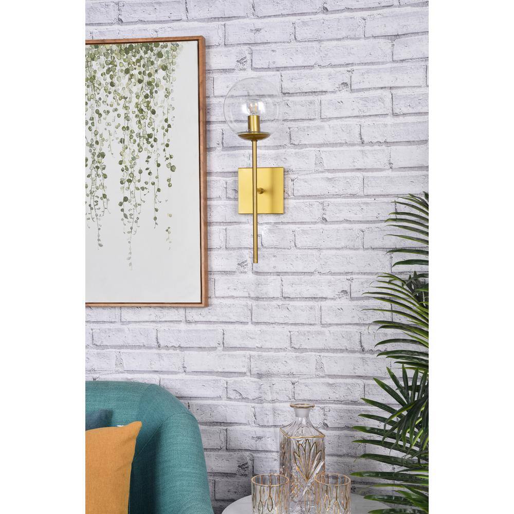 Left. Living District - Neri 1 light brass and clear glass wall sconce - Brass And Clear.