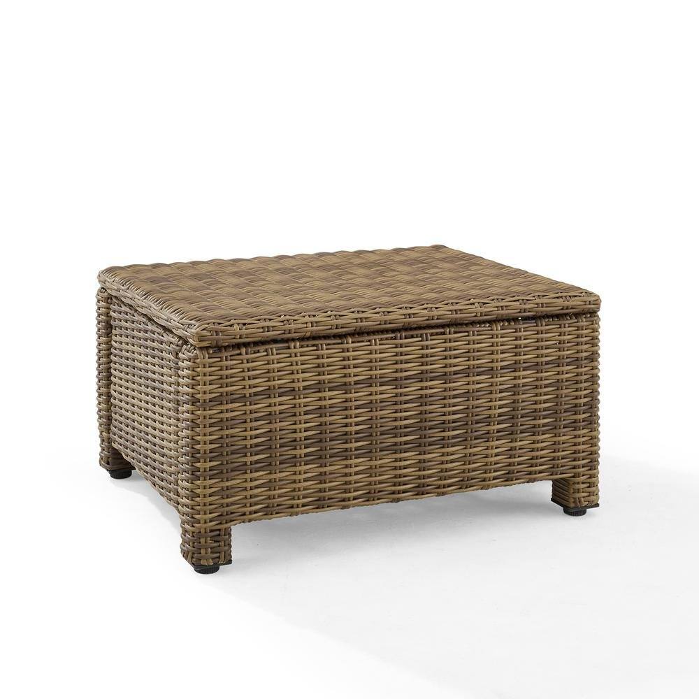 Left. Outdoor Escape - Brown Wicker Outdoor Ottoman with Sand Cushion – Foot Rest for Patio Lounging - Sand.