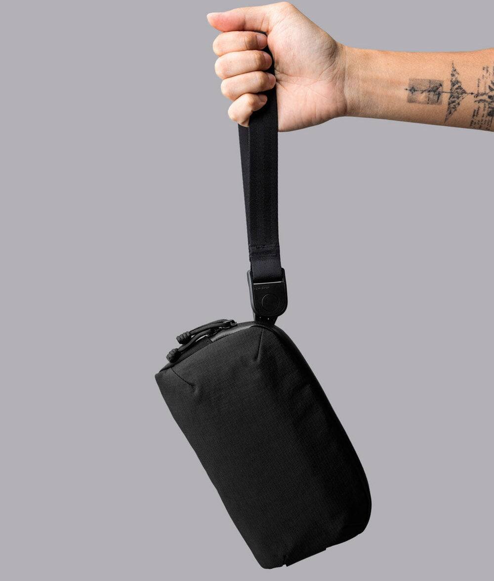 Left. ALPAKA - Flight Pouch Pro 0.7L Men's Carry-All & Organizer Clutches;Crossbody Bag for Men with RFID Blocking, Passport Holder - Black | Axoflux 400D Ripstop Nylon.