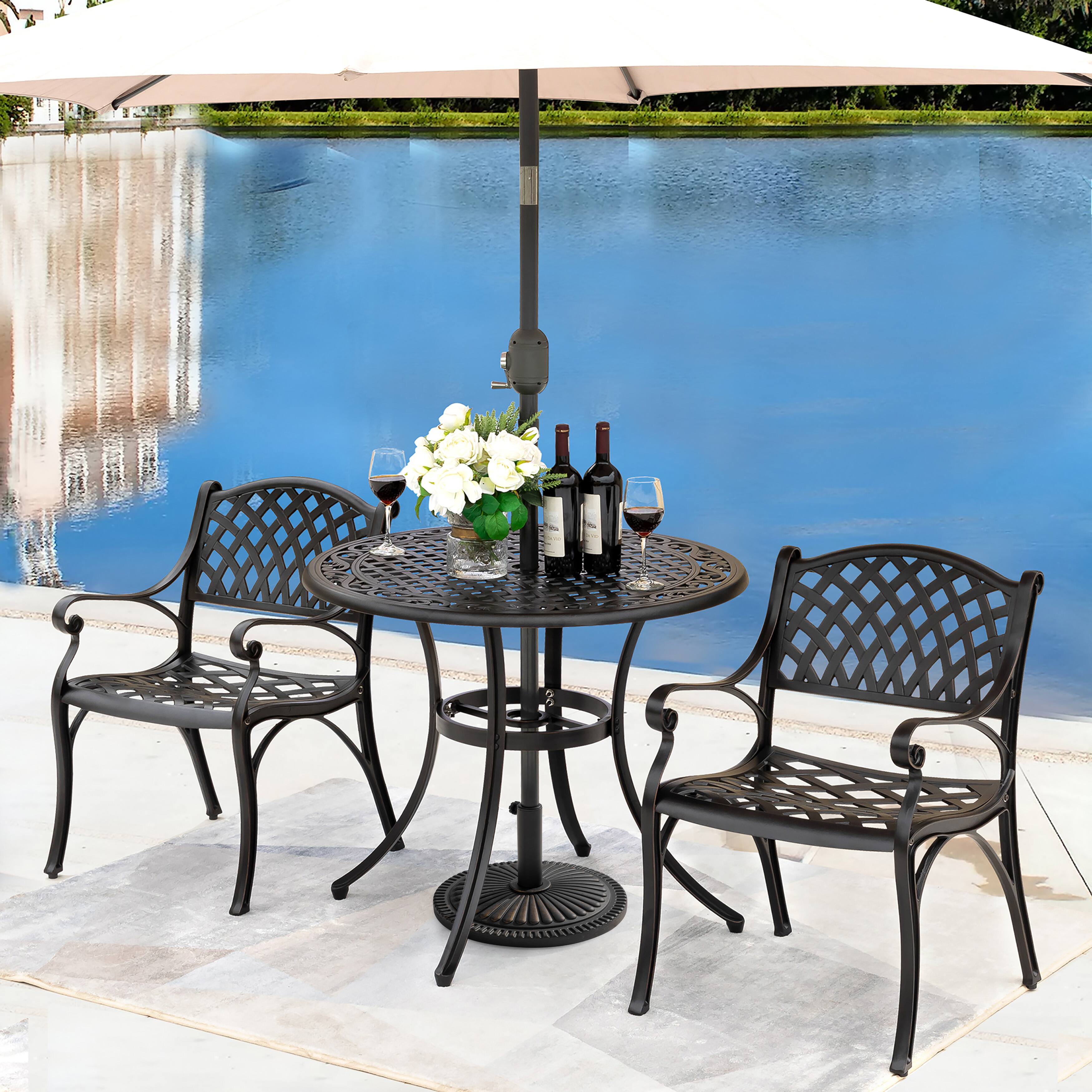 Angle. Nuu Garden - Outdoor 33 lb. Round Patio Umbrella Base, Polyethylene and Concrete - Black with gold-painted edge.