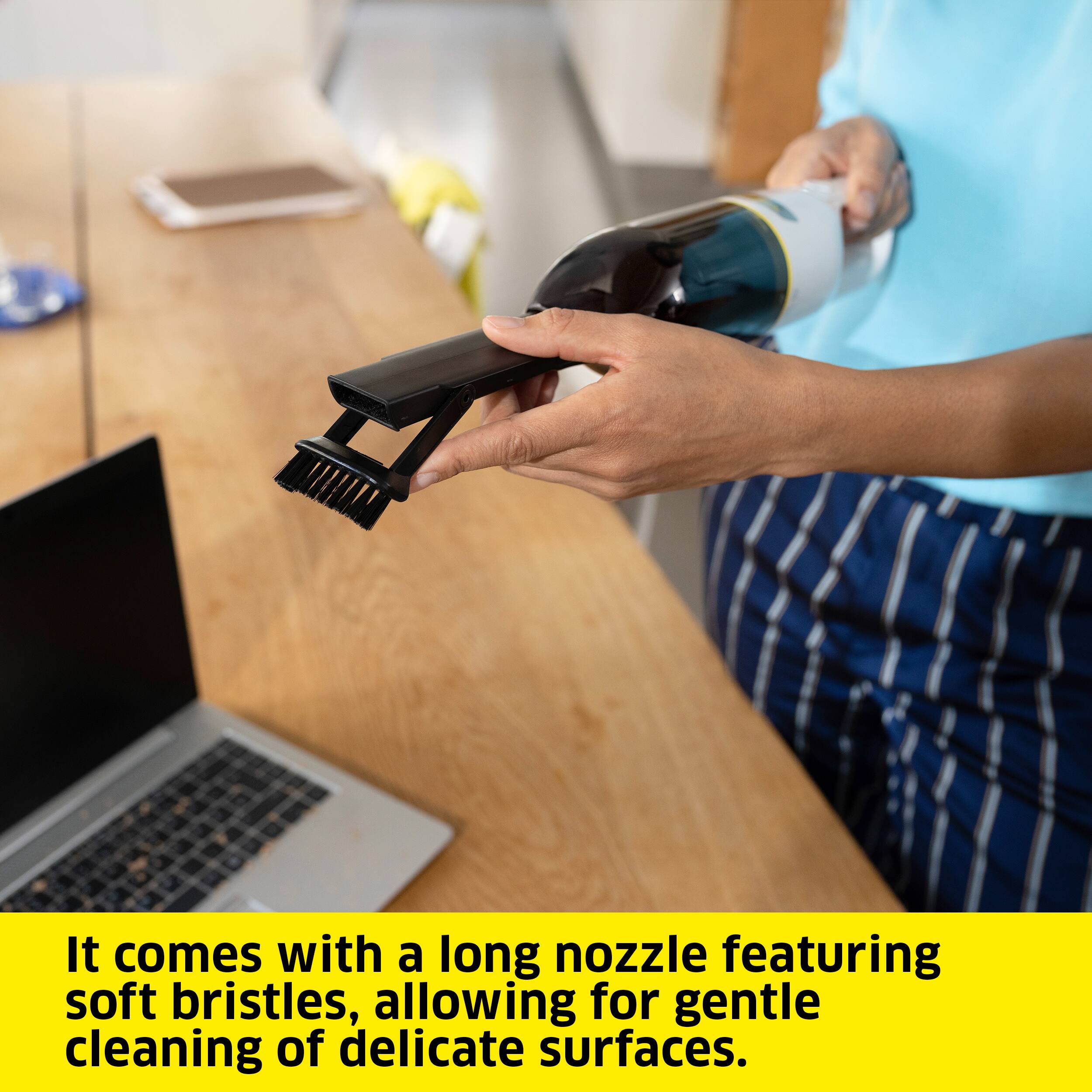 It comes with a long nozzle featuring soft bristles, allowing for gentle cleaning of delicate surfaces.