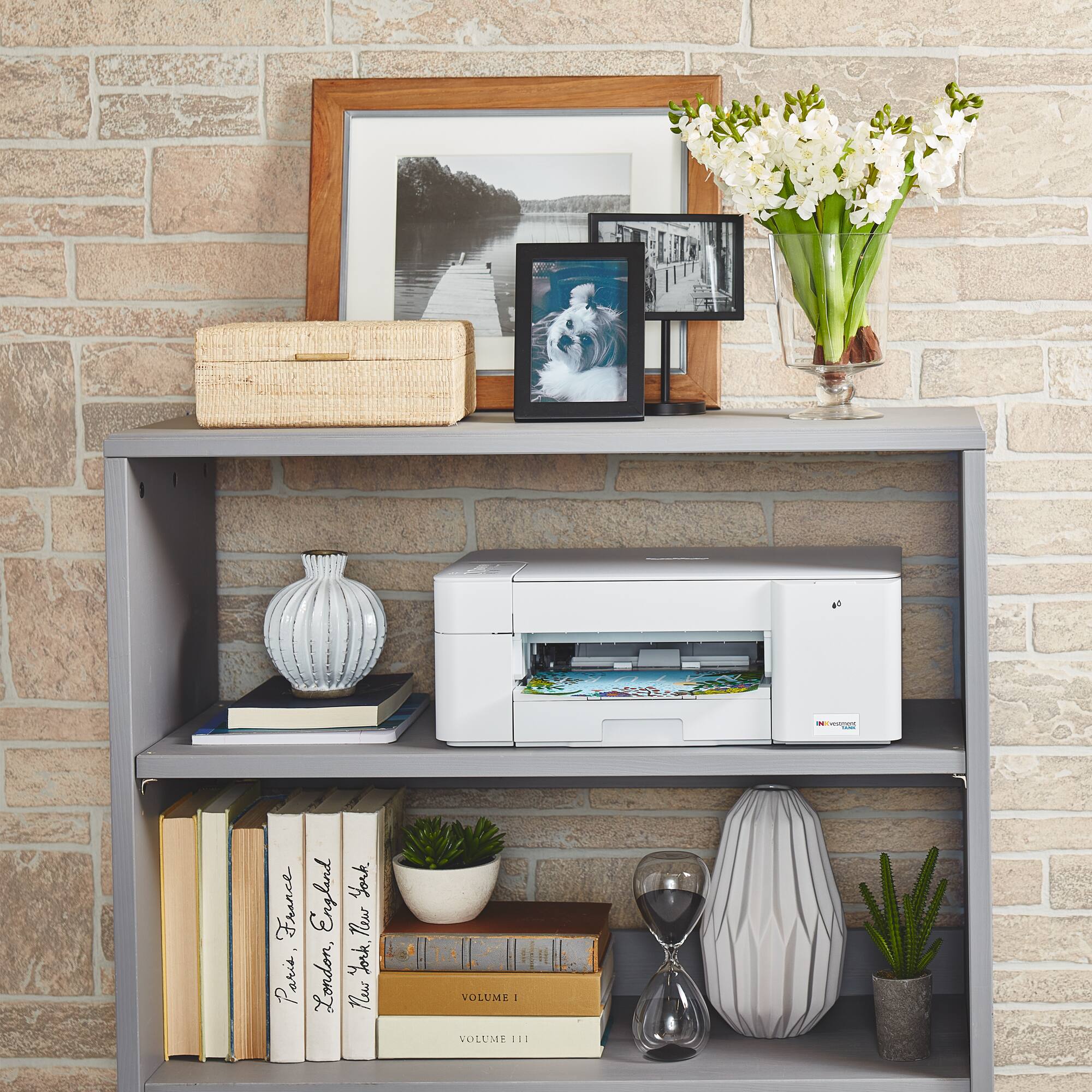 The text on the image reads: "I England York France Tlu York P Paris London, News VOLUME I VOLUME II."