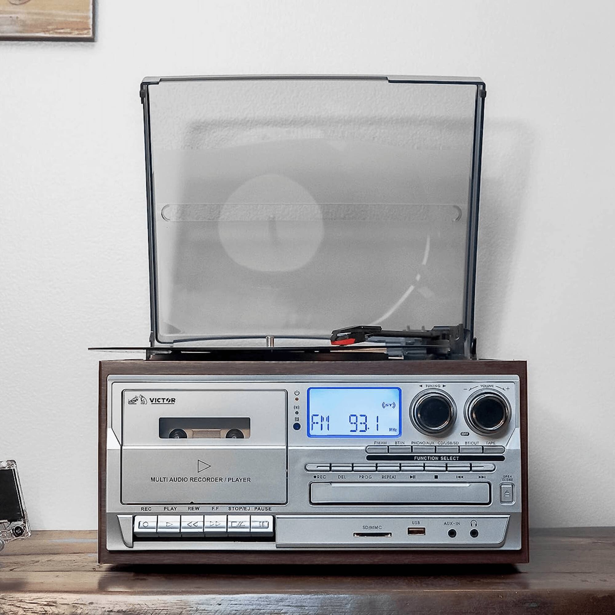 Sure, here is the corrected and grouped text from the image:
**Top Section:**
- FM 93.1 MHz
**Middle Section:**
- VICTOR
- MULTI AUDIO RECORDER/PLAYER
**Bottom Section:**
- REC PLAY REW FF STOP/PAUSE
- SD/MMC USB AUX-IN
- FUNCTION SELECT
- REC DEL PROG REPEAT
- FM1 (xY) 93.1
- I ena I MABE
- POOA A. addis od LAM no SELECT MULTIAUDIO RECORDER/PLAYER T 150 TRO0 IFIE
- - C.. REC PLAY REW .. SI PAUSE LO - < P CK
- SMM USE AX