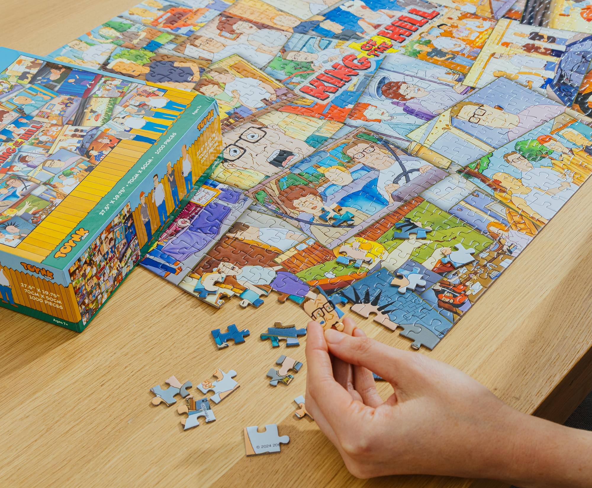 Sure, here is the corrected and grouped text from the image:

**On the Puzzle Box:**
- "TOYS"
- "75.5" x 107.5" (192cm x 273cm)"
- "7000 PIECES"
- "© 2024"

**On the Puzzle Pieces:**
- "© 2024"

**On the Puzzle Box (Side):**
- "TOYS"
- "75.5" x 107.5" (192cm x 273cm)"
- "7000 PIECES"

**On the Puzzle Box (Top):**
- "TOYS"
- "75.5" x 107.5" (192cm x 273cm)"
- "7000 PIECES"

**On the Puzzle Box (Side):**
- "TOYS"
- "75.5" x 107.5" (192cm x 273cm)"
- "7000 PIECES"

**On the Puzzle Box (Top):**
- "TOYS"
- "75.5