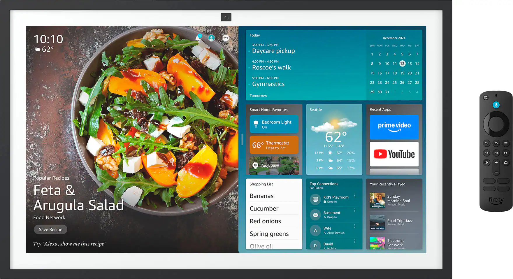 The image shows a computer screen with a variety of information displayed. The main focus is a recipe for Feta & Arugula Salad, which includes a list of ingredients such as bananas, cucumber, red onions, spring greens, olive oil, and other items. The screen also displays a calendar, a shopping list, and a list of top connections. Additionally, there is a section for recent apps, and a popular recipe is featured on the screen. The image also shows a remote control, possibly for a smart home system, and a clock.