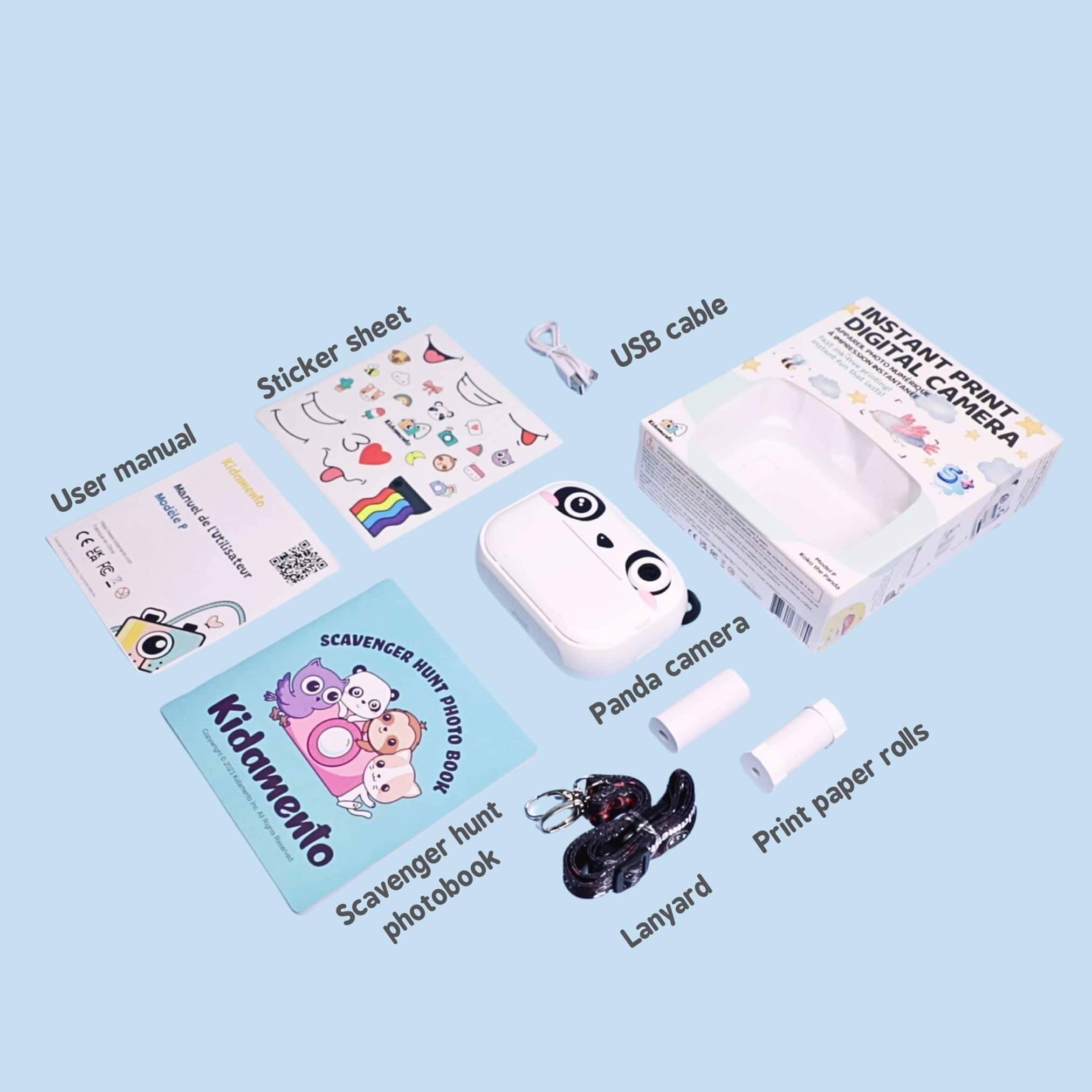 The image shows a collection of items, including a camera, a photo book, a scavenger hunt, and a lanyard. The items are arranged in a way that highlights their features and functions. The photo book is designed to hold photos, while the scavenger hunt is a fun activity that encourages exploration and discovery. The camera is a versatile tool for capturing images and the lanyard is a practical accessory for keeping the camera secure and within easy reach. The collection of items is likely intended for use by children, as indicated by the presence of a Kidamento photo book and the scavenger hunt.